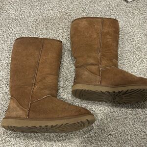 UGG boots genuine leather with sheep skin lining some wear.